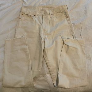 Off-white/cream colored Levi’s.